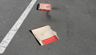 Pizza boxes thrown out onto one of the foreshore carparks. Photo: Hele Ikimotu