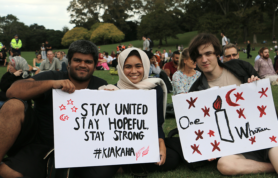 From left: Karan Titus, 24, Ruth Stowers, 20, and Jasper Poole, 18 send their messages of support to the people of Christchurch and the Muslim community. Photo: Irra Lee
