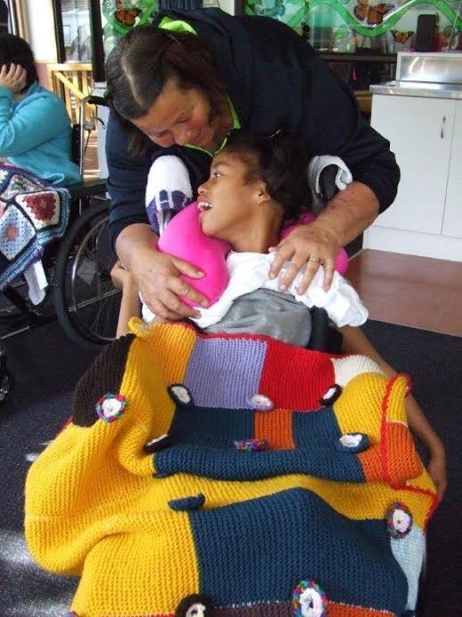 Kids enjoy the warmth of knitted blankets