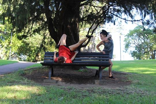 Two girls performing in the park