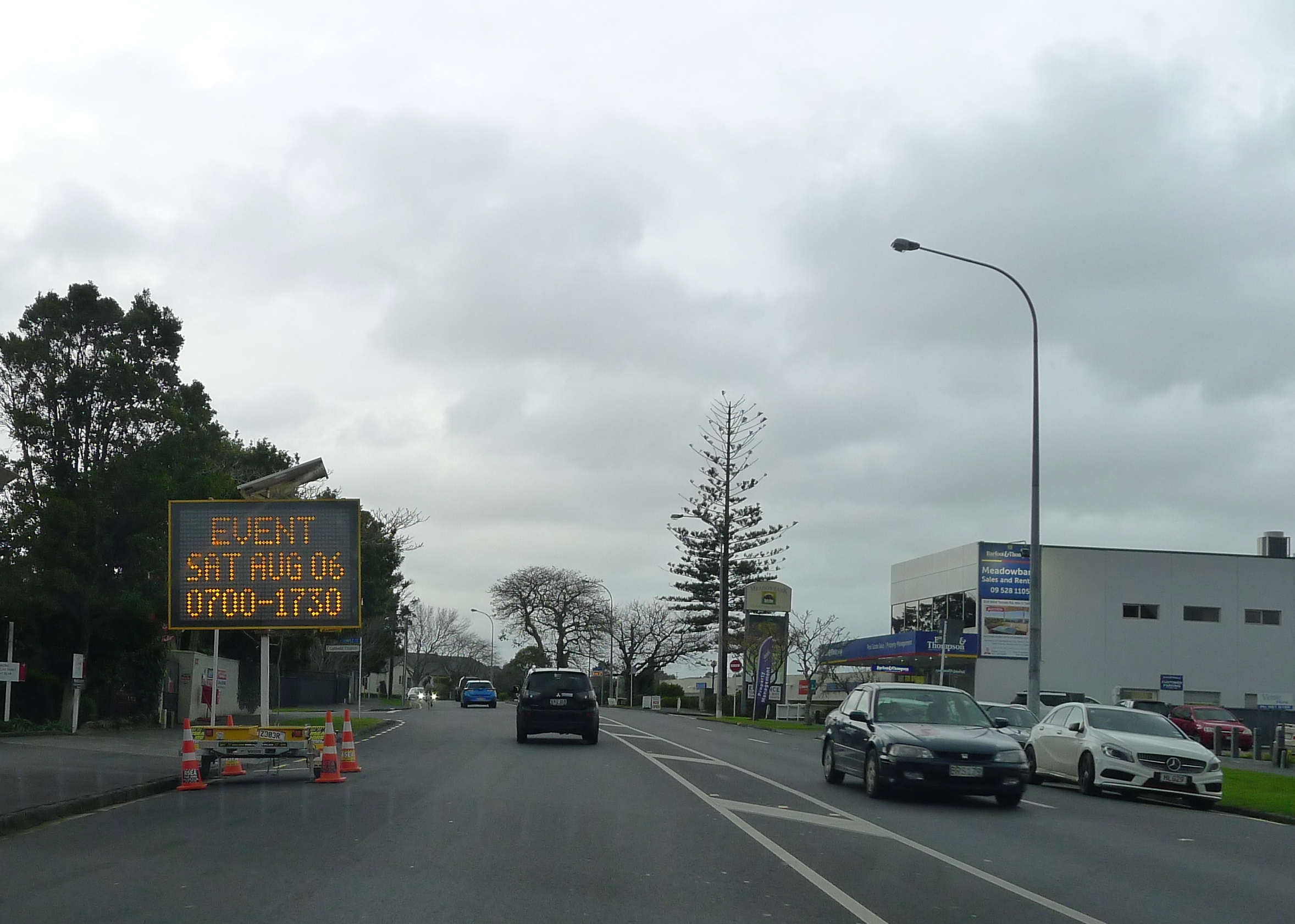 A sign with a time